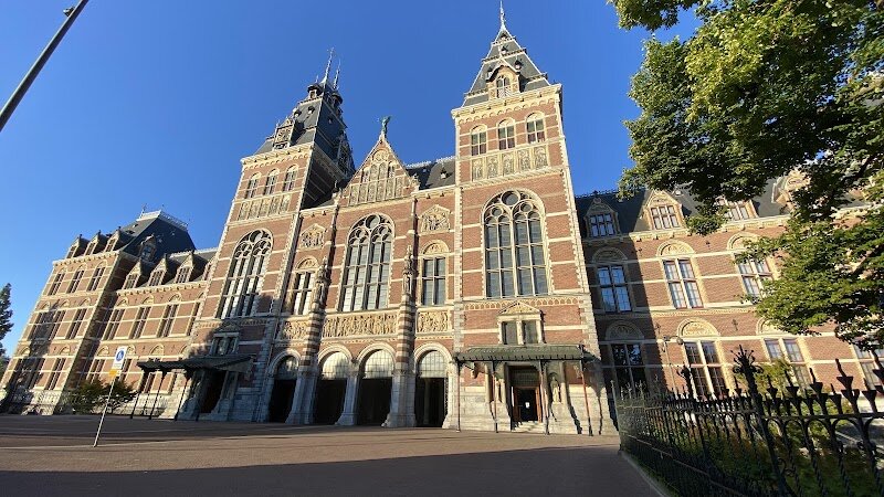 Rijksmuseum - The Rijksmuseum in Amsterdam is a captivating journey through eight centuries of Dutch art, history, and imagination, making it a must-visit for families and curious travelers alike. Housed in a magnificent neo-Gothic building designed by Pierre Cuypers and opened in 1885, the museum itself is an architectural masterpiece, blending Gothic and Renaissance styles with intricate details that spark wonder before you even step inside. Once inside, visitors can explore over 8,000 objects on display, from dazzling paintings and historic artifacts to intricate dollhouses and ship models that appeal to all ages. The museum is home to world-renowned treasures like Rembrandt’s dramatic “The Night Watch” and Vermeer’s luminous “The Milkmaid,” offering not just stunning visuals but also a window into the Dutch Golden Age—a time when the Netherlands was a global leader in art, science, and trade. Founded in 1800 and relocated to Amsterdam in 1808, the Rijksmuseum has grown from a small national collection to one of the world’s premier art institutions. Families can embark on a treasure hunt through Dutch history, while art lovers of all ages will find inspiration in the masterworks that define a nation’s creative spirit.