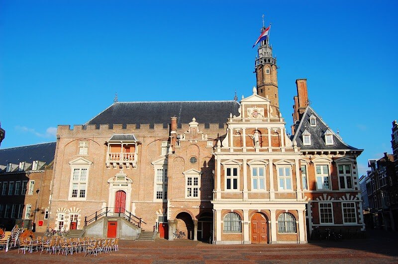 Town Hall Haarlem - Town Hall Haarlem, located on the lively Grote Markt, is a striking symbol of Dutch history and architectural splendor just outside Amsterdam. Families and curious travelers will be captivated by its blend of **medieval origins and Renaissance flair**—the original structure dates back to the 14th century, while the elegant façade was added by famed architect Lieven de Key in the 17th century, showcasing ornate Dutch Renaissance details. This grand building has witnessed centuries of local life as the seat of Haarlem’s government and stands as one of the **oldest city halls in the Netherlands**. Step closer to admire its distinctive chimneys and classicist front, then imagine the tales held within: the interior is adorned with historic paintings and fascinating artifacts, including a massive whale bone and portraits of the Counts of Holland, offering a vivid glimpse into the region’s noble past. Though the Town Hall is still a working government building, its rich history and breathtaking architecture make it a must-see for anyone eager to experience the heart and heritage of Haarlem. It’s a place where every stone and decoration tells a story, inviting visitors of all ages to step back in time and discover the city’s enduring charm.