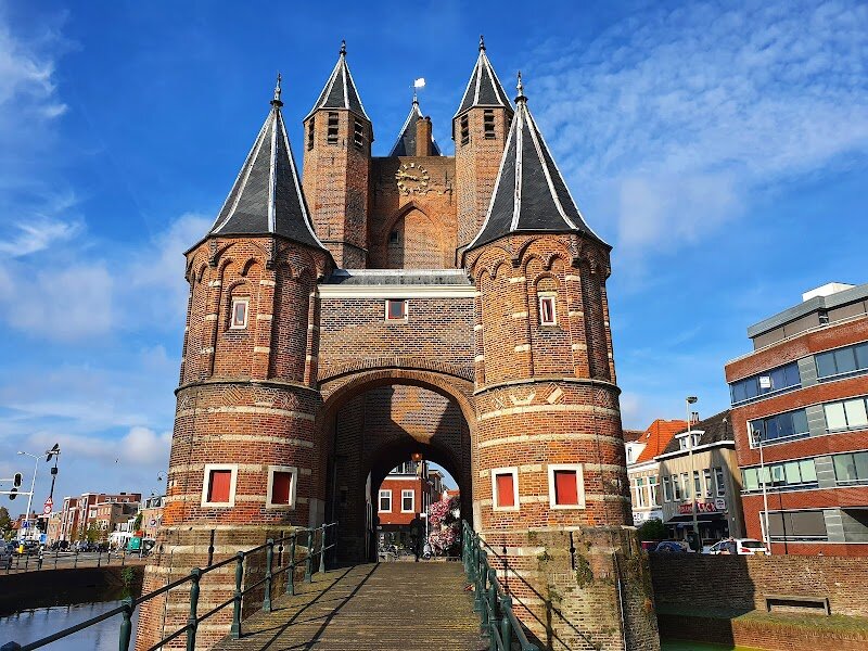 Amsterdamse Poort, Haarlem - The **Amsterdamse Poort** in Haarlem is a captivating portal to the city’s medieval past, inviting families and curious travelers to step into centuries of history and discovery. Built around 1355, this striking gate is the only survivor of Haarlem’s original twelve city gates, standing as a proud testament to the city’s resilience and evolution. Its impressive Gothic and Romanesque architecture—complete with intricate stone carvings and sturdy turrets—offers a feast for the eyes and sparks the imagination of visitors of all ages. Strolling through the Amsterdamse Poort, you’ll sense the echoes of bustling traders and travelers who once passed beneath its arches, connecting Haarlem with Amsterdam and beyond. The gate’s walls are adorned with historic sculptures and emblems, each telling stories of noble families, daily life, and the city’s enduring spirit. Families can wander the picturesque cobblestone streets nearby, explore quaint shops and cozy cafes, and soak in the vibrant local atmosphere. For history buffs, the gate’s enduring presence and the small museum nearby offer deeper insights into Haarlem’s rich heritage. Whether you’re seeking architectural marvels, a scenic stroll, or a living link to the past, the Amsterdamse Poort is an unforgettable highlight of Haarlem—where history truly comes alive.