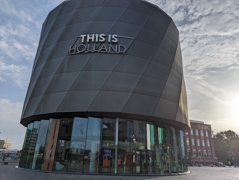 This is Holland - This is Holland offers families and curious travelers an unforgettable journey through the heart of Dutch history and landscape—all without leaving Amsterdam’s city center. Housed in a striking round building by the IJ river, this immersive attraction brings the story of the Netherlands vividly to life, starting with an engaging introduction to the nation’s centuries-old battle against water and its remarkable engineering feats. The highlight is the spectacular 5D flight experience, where visitors are lifted into the air by a state-of-the-art flying simulator—the first of its kind in the Benelux region. You’ll soar over iconic sights, from Amsterdam’s shimmering canals and vibrant tulip fields to legendary windmills, the impressive Delta Works, and tranquil Wadden Islands. The experience is enhanced by wind, mist, and even scents, making you feel as if you’re gliding above the Dutch countryside itself. Beyond the thrill, This is Holland is educational and fun, with interactive pre-shows that reveal the country’s rich heritage and culture. It’s a perfect way for families and explorers to discover the diversity, resilience, and beauty of the Netherlands—all in just one hour, making it ideal for those short on time but eager for adventure.