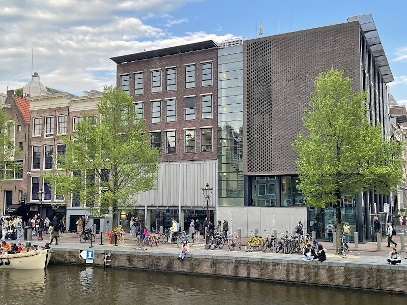 Anne Frank House - The **Anne Frank House** in Amsterdam offers families and curious travelers a profoundly moving encounter with history. Nestled along the picturesque Prinsengracht canal, this preserved 17th-century home is where Anne Frank, her family, and four others hid in the *Secret Annex* for over two years during World War II, evading Nazi persecution. The museum stands not only as a testament to the horrors of the Holocaust but also as a symbol of resilience and hope, immortalized by Anne’s world-famous diary. Stepping inside, visitors are transported back in time, navigating the narrow corridors and hidden rooms that sheltered the group. The atmosphere is both haunting and inspiring, as personal artifacts and poignant displays reveal the daily realities of life in hiding, underscored by Anne’s dreams and reflections. Families can explore interactive exhibits that foster understanding and empathy, while the original diary—preserved and displayed—connects generations to Anne’s enduring voice. The Anne Frank House invites reflection on tolerance and human rights, making it a must-see for anyone seeking to understand the past and its lessons for the future.