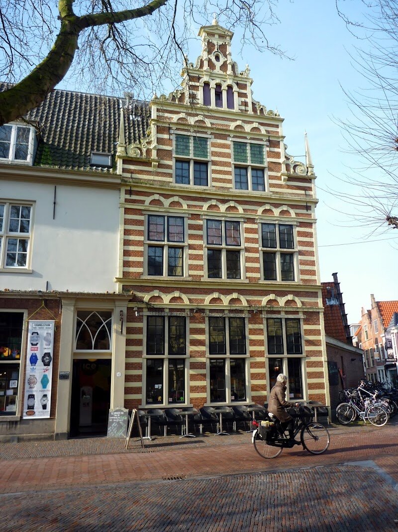 Proveniershuis - Step into the Proveniershuis and discover a hidden gem in the heart of Haarlem—a place where centuries of history and community come alive. Originally founded in 1707 to house elderly men who could afford their own upkeep, this remarkable hofje stands apart from others in the Netherlands. Unlike the typical hofjes built for impoverished women, Proveniershuis features spacious residences arranged around a lush, oversized courtyard—perfect for families to wander and for children to play among the greenery. The site’s story stretches even further back: once a 14th-century nunnery, the Proveniershuis later served as a militia headquarters and even a grand inn, before becoming the serene haven it is today. Echoes of its colorful past linger in the architecture and in tales of notable residents, like the legendary “giant” Daniel Cajanus and playwright Pieter Langendijk. Modern visitors can stroll through the tranquil gardens, admire the historic façades, and relax in the inviting lunchroom that now welcomes shoppers and travelers alike. Whether you’re a curious explorer or a family seeking a peaceful retreat, Proveniershuis offers a unique glimpse into Haarlem’s rich heritage and the enduring spirit of its community.