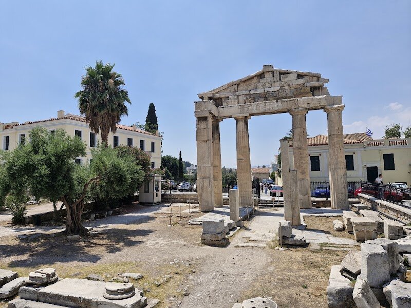 Roman Forum of Athens (Roman Agora) - Step into the captivating world of the **Roman Forum of Athens (Roman Agora)**, where ancient history comes alive for families and curious travelers alike. Nestled just north of the Acropolis, this remarkable open-air marketplace was built in the late 1st century BCE with the support of Julius Caesar and Emperor Augustus, marking the city’s transition from Greek to Roman rule. Once bustling with merchants and citizens, the Agora was the beating heart of Roman Athens—its commercial and civic center. Wander among the marble columns and imagine the lively exchanges that once filled this square. Kids and adults will be fascinated by the **Tower of the Winds**, an ingenious octagonal clock and weather station that still stands, adorned with carvings of the eight winds from Greek mythology. Explore the remains of ancient shops, walk through grand gateways like the Gate of Athena Archegetis, and discover a fountain that once refreshed weary visitors. The Roman Agora offers a hands-on journey through time, blending stories of emperors and everyday Athenians. Whether you’re a history buff or just eager to spark your family’s imagination, this evocative site invites you to uncover the layers of Athens’ rich past right under your feet.