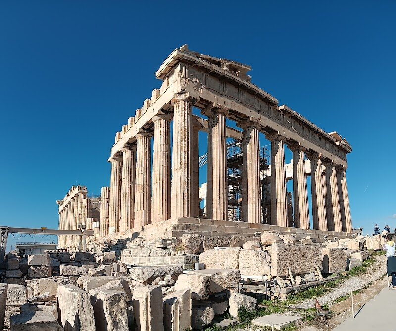 Temple of Athena Nike - Rising gracefully atop the Acropolis, the **Temple of Athena Nike** invites families and curious travelers to discover a jewel of ancient Athens that blends history, myth, and breathtaking artistry. Dedicated to Athena, the city’s patron goddess, and Nike, the spirit of victory, this compact yet elegant temple has watched over Athens since 420 BCE, embodying the hopes of a city yearning for protection and triumph. What makes this site truly special is its **unique Ionic architecture**—the earliest on the Acropolis—and its dramatic perch on a high bastion, offering sweeping views of Athens below. Children and adults alike will be fascinated by the temple’s marble reliefs, especially the famous depiction of Nike fixing her sandal, a symbol of reverence and victory now housed in the Acropolis Museum. As you wander the grounds, imagine ancient Athenians celebrating military successes and seeking divine favor at this sacred site. Though modest in size compared to the Parthenon, the Temple of Athena Nike dazzles with its intricate carvings and rich stories. Visiting here is a chance to step into the footsteps of history, marvel at centuries-old artistry, and share in the enduring spirit of victory that shaped a civilization.
