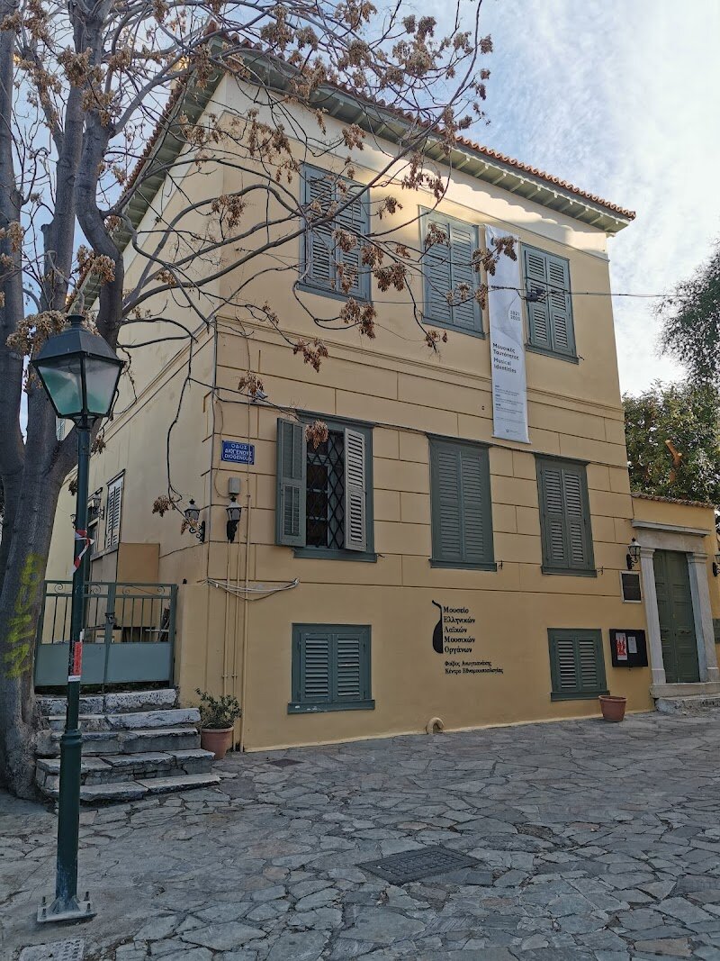 Museum of Greek Folk Musical Instruments "Fivos Anoyanakis" - Centre for Ethnomusicology - Nestled in the charming Plaka district of Athens, the Museum of Greek Folk Musical Instruments "Fivos Anoyanakis" - Centre for Ethnomusicology is a treasure trove for music lovers and curious travelers alike. This unique museum is a testament to the dedication of musicologist Fivos Anoyanakis, who spent 50 years collecting over 1,200 traditional instruments from across Greece. Housed in a beautiful 19th-century mansion, the museum showcases a rich array of instruments, from wind and string to percussion, each telling a story of Greece's vibrant musical heritage. What makes this place truly special is its role as a hub for preserving and celebrating Greek folk music. Visitors can explore exhibits divided by instrument type, listen to musical examples, and even attend traditional performances. Families will enjoy interactive educational programs, while music enthusiasts can delve into the archives and research center. The museum is not just a collection of instruments; it's a gateway to understanding the cultural depth of Greece, making it a must-visit for anyone interested in history, music, or simply experiencing the heart of Greek culture.