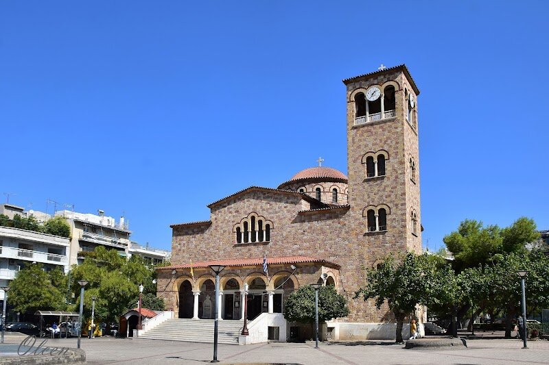 Church of St. John - Tucked away in Athens' charming Psirri district lies one of the city's most extraordinary hidden gems: the Church of St. John Around the Column. This remarkable 12th-century chapel tells a captivating story that spans over 2,500 years of history. What makes this tiny Byzantine church absolutely unique is its most unusual feature – it was literally built around an ancient Corinthian column from the 5th century BC, believed to be part of a sanctuary dedicated to Asclepios, the Greek god of healing. The church's nickname, "Agios Ioannis stin Kolona," perfectly captures this architectural marvel that seamlessly blends ancient Greek and medieval Christian heritage. Step inside this intimate single-aisle chapel and you'll discover walls adorned with beautiful icons, while beneath your feet flows the ancient river Eridanos – on rainy days, you can actually hear the water moving below. The church stands on foundations dating back to the 9th century, making it a true archaeological treasure. For families seeking Athens' authentic character beyond the famous monuments, this well-hidden sanctuary offers a magical glimpse into the city's layered past, where ancient mythology and Christian tradition intertwine in the most unexpected ways.