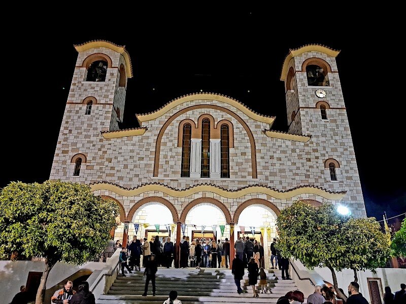 Holy Church of Saint Barbara at Argyroupoli - Step into the enchanting world of the **Holy Church of Saint Barbara at Argyroupoli**, a hidden gem that weaves together centuries of history, faith, and community spirit. This remarkable church, believed by tradition to stand on holy ground sanctified for over a thousand years, captivates visitors with its storybook past and welcoming presence. What makes this church truly special is its miraculous legend: once lost beneath earth and stones and used as a humble sheep pen, the site was rediscovered when a shepherd dreamed of a young woman—Saint Barbara herself—leading to the unearthing of her revered icon. Today, this icon is cherished as a holy relic, drawing pilgrims and curious travelers alike to experience its aura of wonder. Families and explorers will delight in the church’s unique three-naved basilica architecture, with each nave dedicated to a different saint, and in the ongoing restoration of its beautiful murals and woodwork. Surrounded by lively city streets yet imbued with peaceful reverence, the Holy Church of Saint Barbara invites you to witness living history, marvel at tales of miracles, and enjoy a moment of reflection in one of Athens’ oldest and most storied sanctuaries.