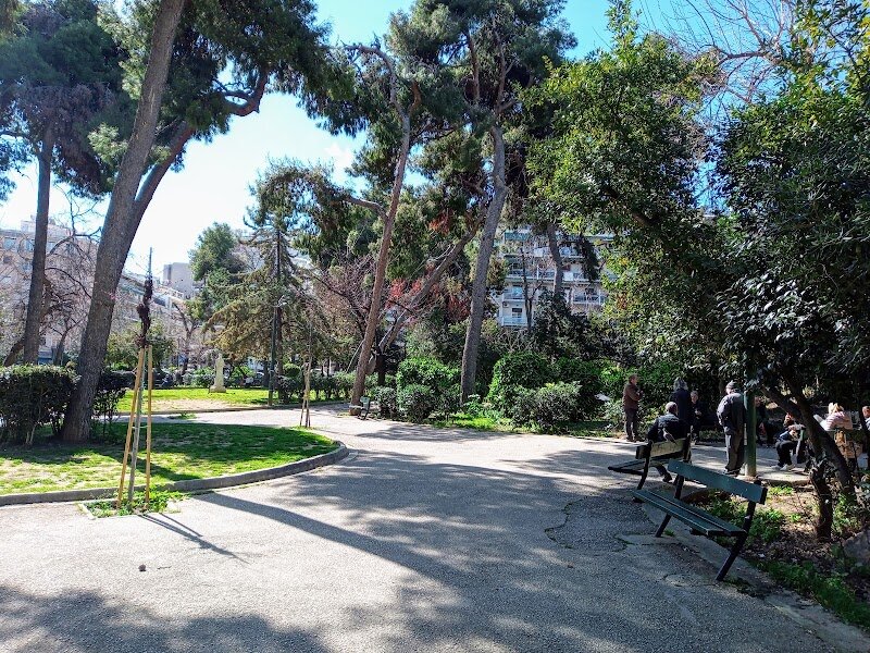 Pangrati Grove - Nestled in the heart of Athens, Pangrati Grove—or Alsos Pangratiou—is a verdant urban oasis that has enchanted locals and visitors alike for over a century. Planted in 1908 under the care of Queen Sofia of Greece and the Philodassiki Enossi Athinon, the grove began as a pine forest and has since grown into a lush, 30-acre sanctuary, offering precious shade and fresh air just moments from the city’s buzz. Strolling through its network of shaded alleys, you’ll discover tall trees, fragrant pines, and a surprising sense of tranquility, as the sounds of the city fade beneath the laughter of children and the rustle of leaves. Families will love the playgrounds, fitness equipment, and basketball courts, while curious travelers can explore the grove’s rich history—from its brief stint as a pre-war zoo to its role as a gathering spot for artists during Greece’s anti-dictatorship movement in the 1970s. Today, the grove remains a lively community hub, dotted with inviting cafés and restaurants where you can relax after a leisurely walk. Whether you’re seeking a peaceful retreat, a dose of local culture, or simply a beautiful place to unwind, Pangrati Grove is a leafy slice of Athenian life that feels both timeless and refreshingly alive.