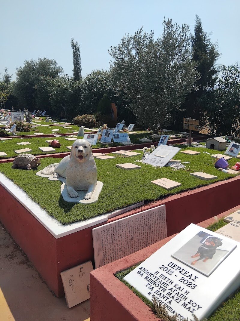 Animal-Cemetery (Κοιμητήριο Ζώων & Αποτεφρωτήριο) - ## Animal Cemetery (Κοιμητήριο Ζώων & Αποτεφρωτήριο) in Athens Nestled within Athens’ urban landscape, the Animal Cemetery (Κοιμητήριο Ζώων & Αποτεφρωτήριο) is a rare and touching sanctuary dedicated to the memory of beloved pets. Unlike the ancient Kerameikos, which served as Athens’ most illustrious burial ground for humans—a place where millennia of social history are etched into marble and myth—this modern cemetery is a testament to the city’s evolving relationship with animals, reflecting a deep, contemporary sense of compassion and respect for all creatures. What makes this place truly special is its tranquil atmosphere, offering families and curious travelers a quiet retreat from the city’s bustle. Strolling among the lovingly tended graves, you’ll encounter heartfelt inscriptions, colorful flowers, and sometimes even playful tributes—a world away from the grandeur of ancient funerary art, yet equally moving. For families, it’s a space to remember, reflect, and teach children about empathy and the cycle of life. For travelers, it’s a unique glimpse into Athenian daily life, where the bond between humans and animals is honored with dignity. While the site itself is modern, its existence speaks to a broader cultural shift—once, dogs in ancient Greece were rarely buried with such sentiment, but today, Athens embraces pets as cherished companions. Visitors can experience a peaceful walk, admire the care taken in each memorial, and perhaps even spot local cats and tortoises basking among the graves, adding to the site’s gentle charm. Whether you’re seeking solace, curiosity, or simply a quiet moment, the Animal Cemetery is a hidden gem that reveals the heart of Athens in unexpected ways.