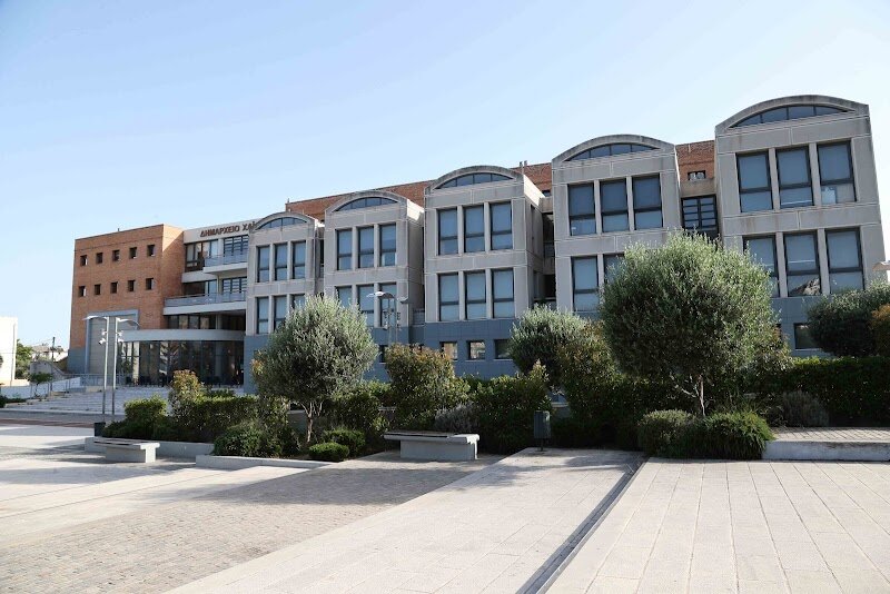 Chaidari City Hall - Chaidari City Hall, nestled in the western suburbs of Athens, is a delightful blend of local heritage and community vibrancy that invites families and curious travelers alike to discover a lesser-known facet of the Greek capital. While Chaidari itself is famed for its lush Diomidis Botanical Garden and the UNESCO-listed Daphni Monastery, the City Hall stands as a proud symbol of civic life and local history. The area flourished under the first king of Greece, and today, the City Hall is surrounded by a tapestry of landmarks—from a small palace-turned-library to parks adorned with wall paintings—all reflecting the town’s evolution and spirit. Visitors to Chaidari City Hall can expect more than just administrative grandeur. The building is a gateway to the neighborhood’s welcoming atmosphere, hosting cultural events and serving as a focal point for local gatherings. Its proximity to family-friendly attractions like parks, swimming pools, and panoramic hills makes it an ideal starting point for exploring the region’s rich past and vibrant present. Whether you're interested in architecture, history, or simply soaking up authentic Athenian life away from the city center, Chaidari City Hall offers a warm, engaging introduction to a community where tradition meets everyday Greek hospitality.