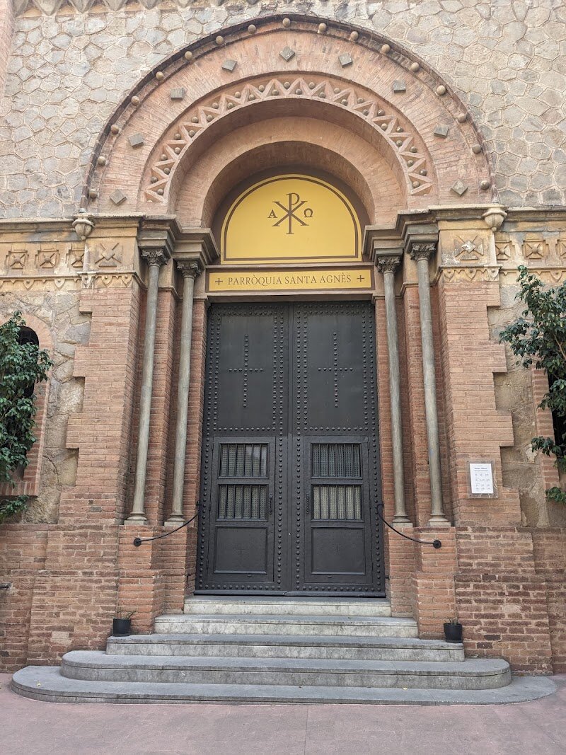 Parròquia Santa Agnès - Parròquia Santa Agnès is a hidden gem in Barcelona’s vibrant Eixample district, offering a warm welcome to families and inquisitive travelers alike. Founded in the early 20th century, this parish stands out for its inviting atmosphere and community spirit, making it much more than just a place of worship—it’s a lively hub for local gatherings, music, and cultural events. The church’s architecture blends neo-Gothic and modernist influences, with soaring vaulted ceilings and colorful stained glass that fill the interior with light and inspiration. Visitors are drawn to Santa Agnès not only for its serene beauty but also for its rich history. Since its inauguration in 1914, the parish has weathered turbulent times, including the Spanish Civil War, emerging as a symbol of resilience and hope for the neighborhood. Today, families can explore its peaceful nave, discover intricate artworks, and enjoy occasional concerts that bring the space to life. Whether you’re seeking quiet reflection or a glimpse into Barcelona’s living heritage, Parròquia Santa Agnès offers an enriching experience that connects past and present in the heart of the city.