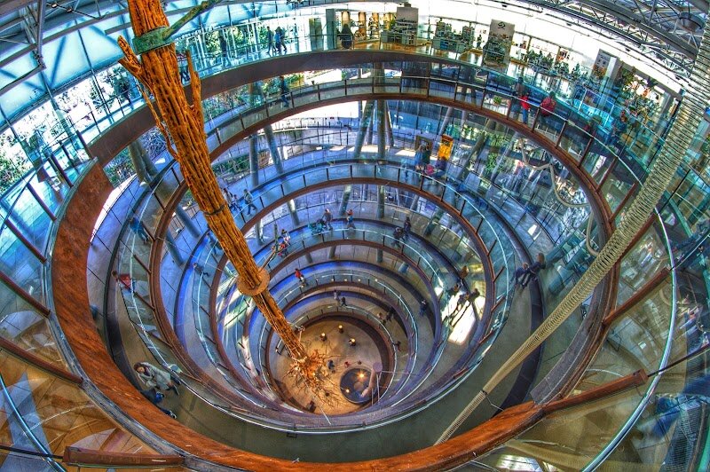 CosmoCaixa Museum of Science - CosmoCaixa, Barcelona’s celebrated Museum of Science, is a wonderland for families and curious minds alike, inviting visitors of all ages to dive into the marvels of nature, space, and technology. Housed in a striking modernista building originally constructed in 1904, CosmoCaixa has transformed from its origins as an asylum for the blind into one of Europe’s most innovative science centers. With over 16.5 million visitors in its 20-year history as CosmoCaixa, it stands out for its interactive, hands-on approach—here, science isn’t just observed, it’s experienced. Step inside and spiral down through the museum’s vast levels, where you’ll encounter everything from a towering Amazonian tree in the heart of the building to the mesmerizing ‘Flooded Forest’ ecosystem. Children and adults can experiment with hundreds of engaging exhibits, tinker with physical and chemical phenomena, and journey from the Big Bang to the human brain with immersive displays. The award-winning planetarium transports you from Earth’s core to distant galaxies, while workshops and live demonstrations spark wonder at every turn. CosmoCaixa’s legacy is one of discovery, making science fun, accessible, and unforgettable for every visitor.