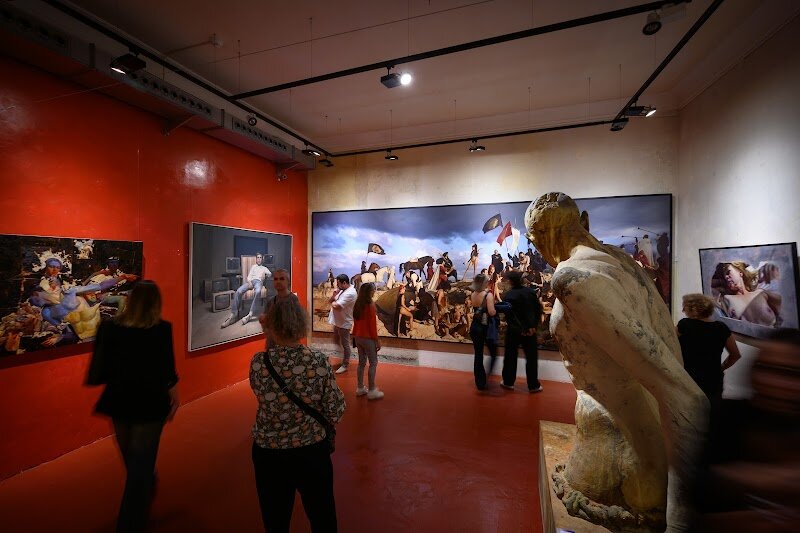 European Museum of Modern Art - The European Museum of Modern Art (MEAM) in Barcelona offers a vibrant journey through contemporary **figurative art**, all within the elegant setting of the historic Palau Gomis, an 18th-century neoclassical palace in the lively Born district. What truly sets MEAM apart is its dedication to showcasing **realist and figurative works** from the 20th and 21st centuries—paintings, sculptures, and drawings that capture modern life with striking skill and emotional depth. Families and curious travelers will be enchanted by the museum’s unique blend of old and new. The centuries-old palace, with its high ceilings and graceful staircases, creates a dramatic backdrop for contemporary masterpieces, making every visit feel like a conversation between history and innovation. MEAM’s exhibitions invite visitors to explore topics such as society, culture, and current events through the lens of today’s artists. Children and adults alike can enjoy interactive workshops, music cycles, and cultural events, ensuring an engaging experience for all ages. Located just steps from the Picasso Museum, MEAM is a hidden gem where tradition meets creativity, inviting everyone to discover the power and beauty of modern figurative art in Barcelona’s artistic heart.