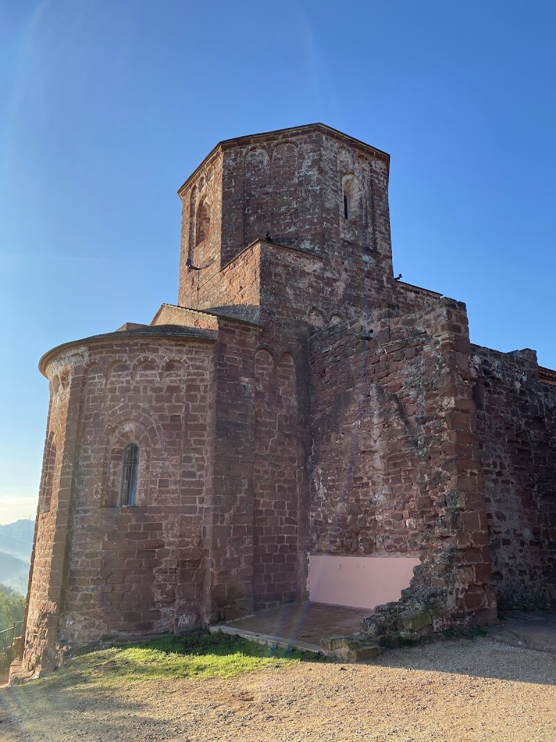 Església de Santa Maria de Cervelló - Tucked beneath the evocative ruins of Cervelló Castle, the **Església de Santa Maria de Cervelló** invites families and curious travelers to step into a storybook setting where history and legend intertwine. This early Romanesque church, crafted from local stone, stands as a testament to the region’s medieval past and the enduring spirit of the Baix Llobregat. As you wander its peaceful surroundings, you’ll sense the echoes of centuries-old prayers and the resilience of a community shaped by frontier life. What makes Santa Maria de Cervelló truly special is its atmospheric location—perched on a gentle hillside, with the castle’s remains watching over the ancient structure. Inside, visitors can admire the simple, harmonious lines typical of Romanesque architecture, offering a serene contrast to the bustling energy of Barcelona. For families, the church and its grounds provide an inspiring backdrop for sharing tales of knights, castles, and the origins of Catalonia. Whether you’re drawn by a passion for history or a love of scenic walks, Santa Maria de Cervelló promises an enriching experience. It’s a place where children can let their imaginations roam and adults can savor the quiet beauty of a living heritage site.