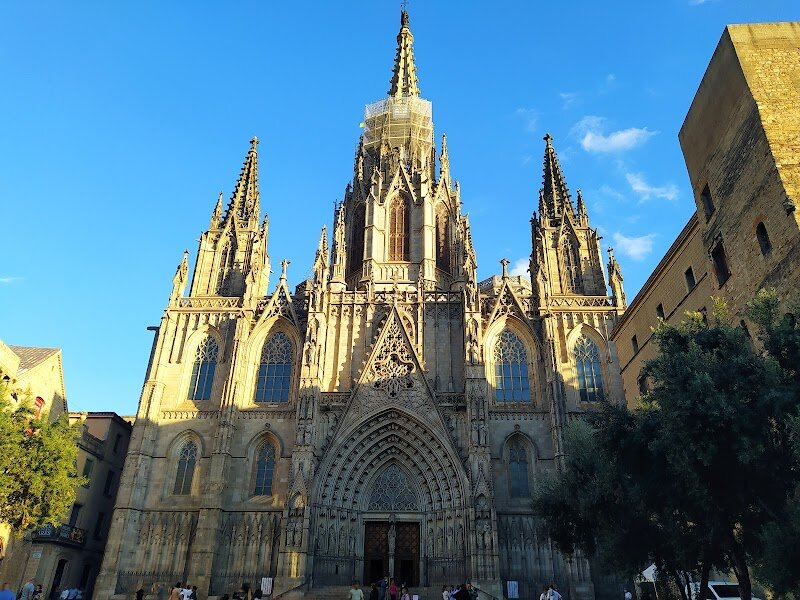 Cathedral of Barcelona - Step into the heart of Barcelona’s vibrant Gothic Quarter and discover the **Cathedral of Barcelona**, officially known as the Cathedral of the Holy Cross and Saint Eulalia—a breathtaking masterpiece of Gothic architecture that enchants visitors of all ages. Rising majestically from the site of a 4th-century basilica, this cathedral’s storied walls echo centuries of history, from Roman times through medieval guilds and legendary saints. Families and curious travelers alike are drawn to its dramatic spires, intricate stained glass, and the serene cloister, where a flock of resident geese add a whimsical touch to the tranquil gardens. Inside, you’ll find soaring arches, ornate chapels, and the crypt of Santa Eulalia, Barcelona’s beloved patron saint, whose courageous story is woven into the city’s spirit. Climb the bell tower for panoramic city views, marvel at centuries-old carvings, and feel the blend of myth and artistry that defines this iconic landmark. The Cathedral of Barcelona isn’t just a place of worship—it’s a living tapestry of legends, art, and community, making it a must-see destination for anyone eager to experience the soul of the city.
