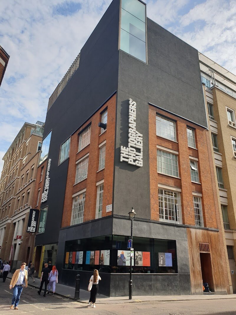 The Photographers' Gallery - Step inside **The Photographers’ Gallery**, London’s vibrant hub for visual storytelling and creative exploration. Founded in 1971 as the UK’s first public gallery devoted solely to photography, this pioneering space has played a key role in elevating photography from documentary to fine art. Housed in a striking five-storey former warehouse in Soho, the gallery invites visitors of all ages to discover world-class exhibitions featuring renowned international artists and groundbreaking British talent. Families and curious travelers will find plenty to inspire: from immersive exhibitions and interactive digital displays to engaging educational workshops designed to spark creativity in visitors young and old. The gallery’s lively café and bookshop offer a welcoming spot to relax and browse, while the Print Sales Gallery lets you take a piece of the experience home. A highlight for many is the prestigious Deutsche Börse Photography Foundation Prize, which celebrates innovation and excellence in contemporary photography. With its ever-evolving program and the new Soho Photography Quarter outdoor space, The Photographers’ Gallery is not just a place to view photographs—it’s a dynamic destination where stories come to life and everyone is invited to join the conversation.