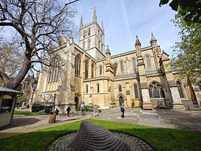 Southwark Cathedral - Southwark Cathedral is a captivating blend of ancient history and breathtaking architecture, nestled on the vibrant south bank of the Thames. With roots stretching back to 606 AD, it stands as one of London’s oldest places of worship, its foundations echoing centuries of faith, resilience, and transformation—from Roman pagan rituals to a medieval Augustinian priory, and later, a parish church deeply intertwined with the city’s story. Families and curious travelers will find much to explore here: wander beneath soaring Gothic arches and marvel at the intricate stained-glass windows, some commemorating figures like William Shakespeare, whose brother is buried within the cathedral. Discover hidden corners, spiral stone staircases, and tranquil chapels that invite quiet reflection, while the 13th-century retrochoir offers a glimpse into the cathedral’s earliest surviving architecture. Outside, the peaceful churchyard and herb garden provide a welcome retreat from the city’s bustle. Southwark Cathedral is more than a historic landmark—it’s a living space where the spiritual and the everyday meet, offering an enriching experience for visitors of all ages. Whether you’re drawn by its rich literary connections, its remarkable architecture, or the sense of serenity within its ancient walls, this hidden gem is an unforgettable stop in the heart of London.