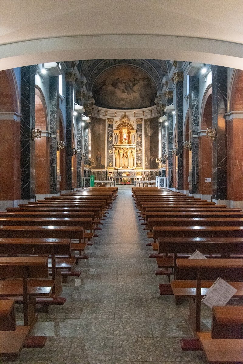 Parish of Our Lady of Covadonga - I appreciate your interest, but I need to clarify an important issue with your query: **Our Lady of Covadonga is not located in Madrid**. The shrine is actually situated in Covadonga, a mountainous region in Asturias in northwestern Spain, not in the capital city. However, I can provide you with a compelling description of the actual **Sanctuary of Our Lady of Covadonga in Asturias**: --- Perched dramatically in the Asturian mountains, the Sanctuary of Our Lady of Covadonga stands as one of Spain's most sacred pilgrimage sites. This remarkable shrine marks the birthplace of Christian Spain, commemorating the legendary 722 victory when King Pelayo and his warriors defeated the Moorish invaders. Nestled within a breathtaking cave, the sanctuary houses a 16th-century statue of the Virgin Mary, believed to have miraculously aided the Christian triumph. The majestic pink limestone Basilica, consecrated in 1901, crowns the hilltop and welcomes thousands of pilgrims annually. Visitors experience profound spiritual atmosphere blended with stunning natural beauty—towering peaks, ancient stone walls, and the sacred grotto where prayers were answered centuries ago. Whether you're drawn by faith, history, or nature's grandeur, Covadonga offers an unforgettable journey into Spain's defining moment.