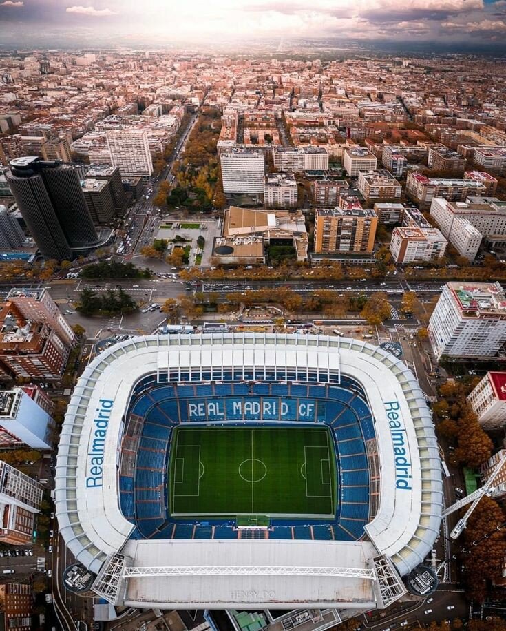 Bernabéu - # Santiago Bernabéu Stadium: A Temple of Football History Nestled in the heart of Madrid, the Santiago Bernabéu Stadium stands as one of the world's most iconic sporting venues and a living monument to football excellence. Built between 1945 and 1947, this legendary arena opened its doors on December 14, 1947, transforming into a symbol of Real Madrid's dominance in European football. What makes Bernabéu truly special is its remarkable evolution. From hosting the first European Cup final in 1957 to witnessing four continental championships, the stadium has been the stage for unforgettable moments. The venue hosted Spain's maiden European Nations' Cup triumph in 1964 and even the 1982 FIFA World Cup final. Beyond match days, visitors can explore the stadium's rich heritage through immersive experiences. The modern facility blends cutting-edge architecture with nostalgic charm, featuring world-class restaurants, interactive exhibits, and the renowned Tour Bernabéu that takes you through the players' tunnel and onto the hallowed pitch. Whether you're a devoted football fan or a curious traveler, Bernabéu offers an unforgettable glimpse into sporting greatness and Madrid's passionate football culture.