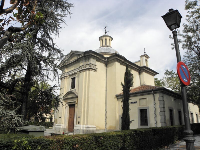 Hermitage of Saint Anthony of La Florida - Tucked away beside the Manzanares River in Madrid lies one of Spain's best-kept artistic secrets: the Hermitage of San Antonio de la Florida. This elegant Neoclassical chapel, completed in 1798, was commissioned by King Carlos IV and designed by Italian architect Filippo Fontana. But what truly transforms this modest building into a masterpiece is its breathtaking interior. The hermitage's dome and walls burst with life through the magnificent frescoes painted by Francisco Goya in just four months during 1798. Unlike typical religious art, Goya populated these sacred scenes with the vibrant characters of everyday Madrid—the *majos* and *majas*, working-class figures depicted with remarkable energy and joy. This intertwining of the divine and mundane creates something utterly captivating, offering visitors a window into 18th-century Madrid's spirit. Beyond its artistic treasures, the chapel holds profound historical significance as the final resting place of Goya himself, who was transferred here in 1919. To preserve these irreplaceable frescoes, an identical chapel was built beside the original in 1928, allowing visitors to experience Goya's genius while protecting this cultural treasure for future generations.