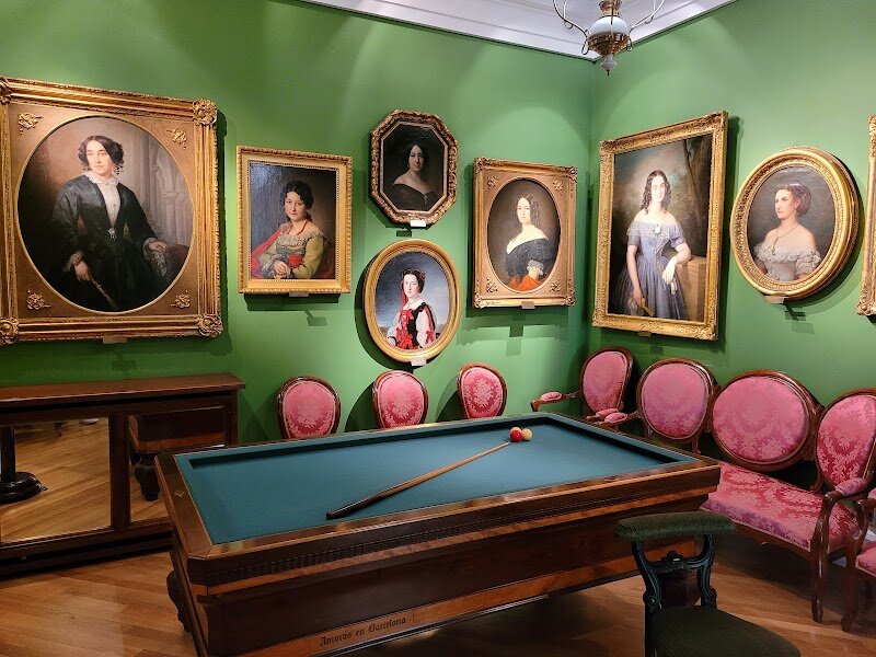 Museo del Romanticismo - Step into the Museo del Romanticismo in Madrid and let yourself be swept away to the dramatic, passionate world of 19th-century Spain. Housed in a beautifully preserved Neoclassical palace, this museum is more than just a collection of art—it’s a journey back in time. Wander through elegant rooms filled with opulent furniture, hand-painted ceilings, and glittering chandeliers, all recreating the atmosphere of a wealthy Romantic-era home. Marvel at masterpieces by legendary artists like Goya, Madrazo, and Alenza, and discover the stories behind their emotionally charged paintings and sculptures. But the magic doesn’t stop at art. The museum brings history to life with personal artifacts, love letters, porcelain dolls, and even the piano once played by Romantic composers. You’ll encounter the pistol of writer Mariano José de Larra and other intriguing objects that reveal the era’s passions and contradictions. Families and curious travelers alike will love exploring over twenty meticulously recreated rooms, each offering a glimpse into the daily lives, tastes, and dreams of Madrid’s bourgeoisie during the Romantic period. With its immersive atmosphere and rich collection, the Museo del Romanticismo is a hidden gem that makes history feel vivid, personal, and unforgettable.