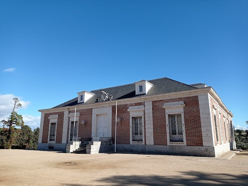 Quinta del Duque del Arco - Nestled in the Monte de El Pardo just outside Madrid lies a hidden gem of 18th-century elegance: the Quinta del Duque del Arco. This enchanting country estate was commissioned in 1717 by Alonso Manrique de Lara y Silva, the Duke of Arco and a favored courtier of King Felipe V, who sought a peaceful retreat from court intrigue. What makes this quinta truly captivating is its harmonious blend of architectural styles. The modest palace echoes the design of La Zarzuela, while the gardens showcase a masterful fusion of French sophistication, Italian decorative elements, and Spanish character. Designed by French landscape architect Claude Truchet around 1726, the baroque gardens feature multiple terraces, ornate fountains, and sculptures that create an atmosphere of refined tranquility. The estate's story extends beyond its golden age. After the Duke's death in 1737, his widow donated the property to Felipe V, who incorporated it into the Royal Estate of El Pardo. Today, this National Monument—designated in 1935—invites visitors to wander through centuries of history, admiring French wallpapers from the 1820s and experiencing the sophisticated leisure lifestyle of Spanish aristocracy. It's a journey through time wrapped in baroque beauty and natural splendor.