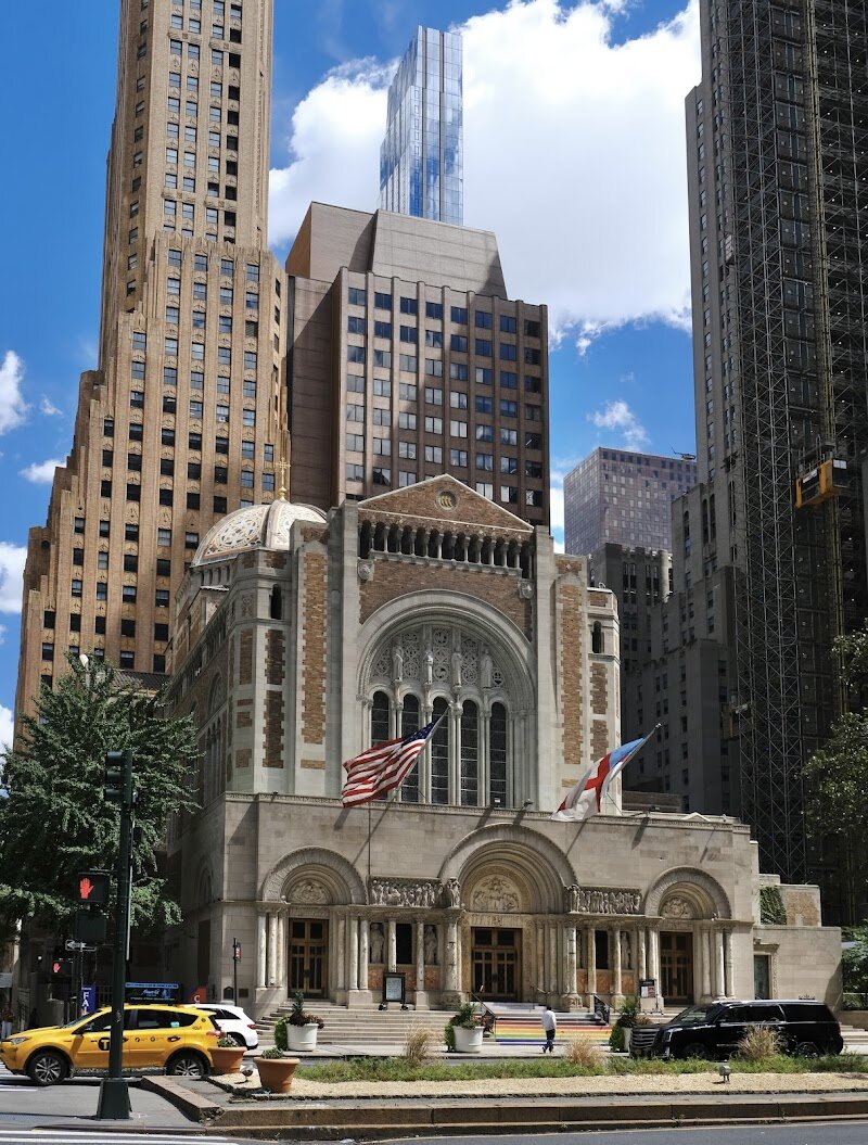 St. Bartholomew's Church - St. Bartholomew’s Church, affectionately known as **St. Bart’s**, is a dazzling architectural gem on Park Avenue that invites families and curious travelers into an atmosphere unlike any other in New York City. With its striking **Byzantine Revival style**, the church’s ornate brickwork, limestone, and colorful terra cotta evoke the grandeur of ancient Constantinople, making it a true standout amid Manhattan’s skyscrapers. Founded in 1835, St. Bart’s has a rich history woven into the fabric of the city, moving from humble beginnings downtown to its current magnificent home, thanks to the vision of renowned architect Bertram Goodhue and the generosity of the Vanderbilt family. The entrance’s spectacular **Triple Portal**, adapted from the church’s earlier location, features intricate bronze doors and sculpted friezes by leading American artists—a breathtaking welcome for visitors of all ages. Inside, families can marvel at vibrant mosaics, stained glass, and a soaring, mosaic-tiled dome, while the church’s lively plaza offers a peaceful oasis and community events just steps from Midtown’s bustle. Whether you’re seeking a moment of awe, a taste of history, or a unique spot to spark children’s curiosity, St. Bart’s is a place where New York’s past and present meet in inspiring harmony.