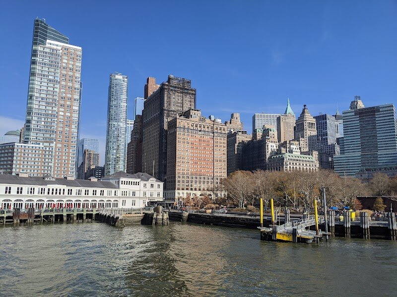 The Battery - The Battery, nestled at the southern tip of Manhattan, is where New York City’s story begins—a place where centuries of history and adventure meet sweeping harbor views. Once the domain of the Lenape people, this waterfront oasis became the first landing spot for Dutch settlers in 1625, who fortified the area with artillery batteries—hence the name “The Battery”. Over the years, it has transformed from a military stronghold to a bustling immigration gateway, with Castle Clinton standing as a living monument to its layered past. Millions of new Americans first set foot here before Ellis Island opened, and today, families can explore the castle’s engaging dioramas and exhibits that bring its many roles to life. Beyond its deep roots, The Battery delights visitors with vibrant gardens, public art, and playful attractions like the SeaGlass Carousel. Wander along its promenades for panoramic views of the Statue of Liberty and the harbor’s busy ferries. The park’s many memorials, including those honoring 9/11 and World War II, invite reflection and storytelling. For curious travelers and families alike, The Battery is not just a park—it’s a living gateway to New York’s past and a joyful playground in its present.