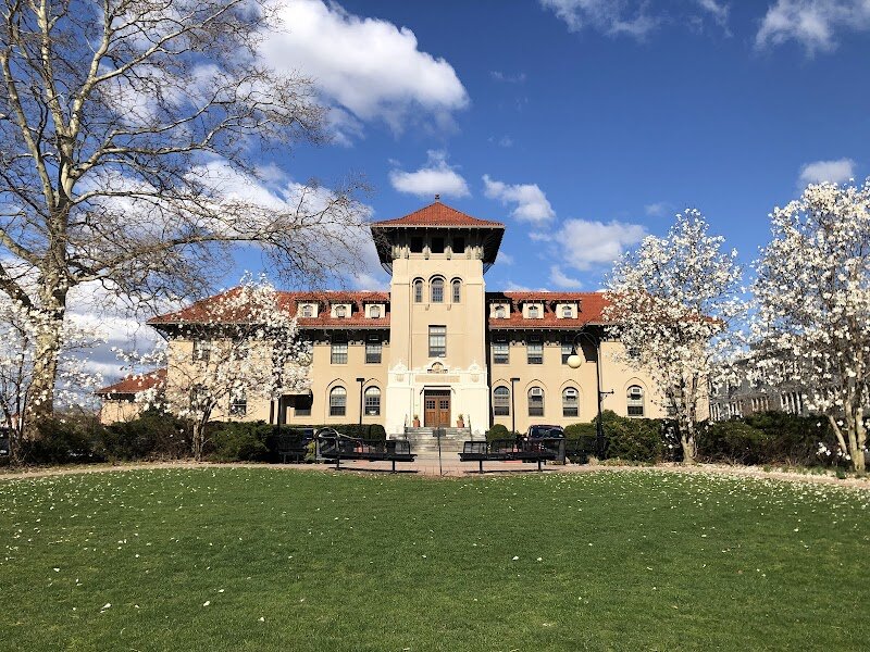 Queens College, City University of New York - Queens College, part of the City University of New York, is a vibrant hub of learning and culture nestled in the heart of Flushing, Queens. Founded in 1937 as “The People’s College,” its roots reach back to the 19th century, making it a place where history and innovation blend seamlessly. The campus, once home to the Jamaica Academy where Walt Whitman taught, now features 80 acres of tree-lined lawns, classic collegiate quads, and striking modern facilities. Families and curious travelers will find much to explore here. Wander through the lush grounds, visit the acclaimed music building, or browse the six-story Rosenthal Library. The college’s diverse community—students hail from over 150 countries—creates a lively, welcoming atmosphere. Visitors can often enjoy concerts, lectures, and art exhibitions, reflecting the school’s deep commitment to the arts and public engagement. Queens College’s legacy as a beacon of opportunity and academic excellence endures, recognized nationally for its top-tier programs and inclusive spirit. Whether you’re tracing the footsteps of history or simply soaking in the collegiate energy, this storied campus offers a rewarding glimpse into New York’s educational and cultural fabric.