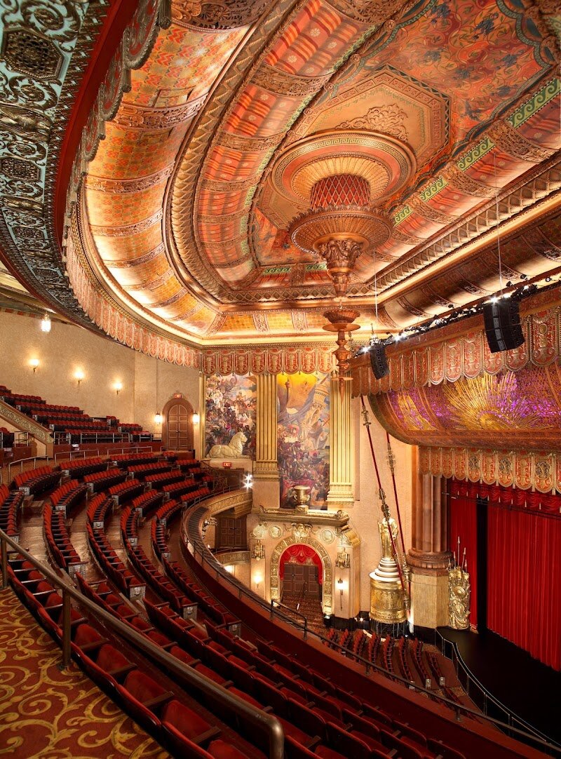 Beacon Theatre - Step into the **Beacon Theatre** and discover one of New York City's most captivating treasures, where history, artistry, and vibrant entertainment converge to create unforgettable memories for visitors of all ages. Opened in 1929, this stunning landmark on the Upper West Side dazzles families and curious travelers with its opulent Art Deco interior, blending Renaissance, Greek, Roman, and Rococo styles into a visual feast of marble floors, towering Greek goddess statues, and hand-painted murals. Beyond its breathtaking architecture, the Beacon Theatre boasts a storied past as a glamorous movie palace and a legendary stage for world-class performers. Over the decades, it has hosted iconic musicians, comedians, dance troupes, and even the teachings of the Dalai Lama—making it a true beacon of creativity and culture in Manhattan. As you settle into one of nearly 3,000 seats beneath a magnificent Venetian chandelier, you’re transported to an era of elegance, ready to experience everything from electrifying concerts to family-friendly shows and inspiring lectures. Whether you’re drawn by its rich history, stunning design, or the promise of live entertainment, a visit to the Beacon Theatre is a chance to share the magic of New York with loved ones and create cherished memories together.