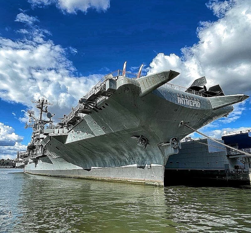 Intrepid Museum - Step aboard the legendary Intrepid Museum and embark on an unforgettable journey through history, innovation, and adventure. Anchored on Manhattan’s West Side, this one-of-a-kind museum is built around the USS Intrepid, a heroic World War II aircraft carrier that survived torpedoes, kamikaze attacks, and earned the nickname “the Ghost Ship” for its resilience. Families and curious travelers will be awed by the chance to explore not only the massive ship itself—a National Historic Landmark—but also a fleet of remarkable exhibits. Marvel at the world’s first space shuttle, the Enterprise, and step inside the USS Growler, the only nuclear-missile submarine open to the public. Stroll among dozens of historic aircraft, including sleek fighter jets and the supersonic Concorde, all displayed in and around the storied carrier’s decks. Interactive exhibits and immersive displays bring to life stories of bravery, ingenuity, and service, making history tangible and thrilling for visitors of every age. The Intrepid Museum stands out for its commitment to inspiring future generations through hands-on STEM experiences, accessible programming, and powerful tales of heroism. It’s more than a museum—it’s a living tribute to the spirit of exploration, discovery, and courage that shaped the modern world.