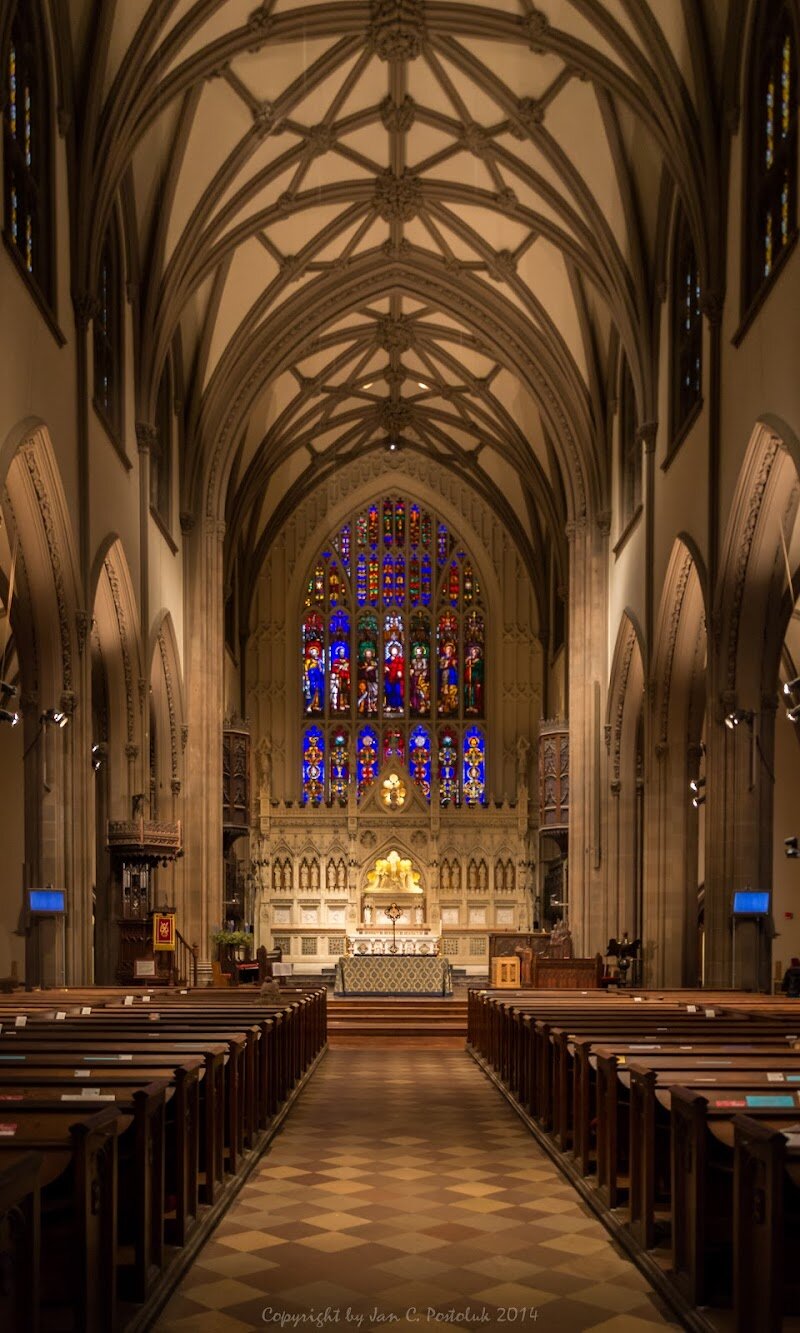 Trinity Church - Trinity Church is a breathtaking Gothic Revival landmark nestled at the head of Wall Street, where its soaring spire rises above the bustle of New York’s Financial District. Families and curious travelers will be captivated by its dramatic architecture and storied past, making it a must-see for anyone exploring Manhattan. Founded in 1696, Trinity Church has witnessed centuries of city history—from colonial times through revolutionary upheaval and into the modern era. The current church, completed in 1846 and designed by Richard Upjohn, is celebrated as one of America’s first and finest examples of neo-Gothic architecture. For decades, its 281-foot steeple was the tallest building in the United States, serving as a beacon for ships entering New York Harbor. Visitors can marvel at the intricate stained glass windows, restored stonework, and peaceful churchyard—where notable figures such as Alexander Hamilton are buried. Inside, the recently renovated sanctuary welcomes all with its luminous interior and offers a tranquil escape from city life. Whether you’re tracing the footsteps of history or simply soaking in the awe-inspiring beauty, Trinity Church promises a memorable experience for every guest.