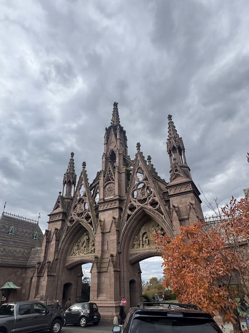 The Green-Wood Cemetery - The Green-Wood Cemetery in Brooklyn is far more than a final resting place—it's a sprawling, 478-acre sanctuary where history, nature, and art beautifully intertwine. Founded in 1838, Green-Wood quickly became a beloved destination, drawing crowds that once rivaled Niagara Falls as families came to stroll its winding paths, admire grand monuments, and picnic under ancient trees. This National Historic Landmark sits atop Brooklyn’s highest point, offering sweeping views and a tranquil escape from city life. What makes Green-Wood truly special is its rich tapestry of stories. Here, visitors can discover the graves of famous New Yorkers like composer Leonard Bernstein and artist Jean-Michel Basquiat, as well as countless unsung immigrants and families who helped shape the city. The grounds themselves are steeped in American history—the Battle of Brooklyn, a pivotal Revolutionary War conflict, was fought right here. Today, Green-Wood invites curious travelers and families to explore its scenic hills, marvel at Victorian-era sculptures, spot wildlife, and join engaging walking tours. Whether you’re a history buff, nature lover, or simply seeking a peaceful retreat, Green-Wood offers a unique journey through New York’s past and present.