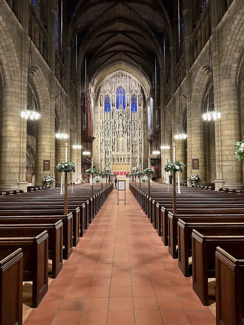 St. Thomas Church - St. Thomas Church on Fifth Avenue stands as a breathtaking tribute to New York’s rich history and architectural grandeur. Designed in the French Gothic style by renowned architects Cram, Goodhue & Ferguson and completed in 1914, its soaring cathedral-like proportions and intricate limestone ornamentation instantly captivate visitors of all ages. Families and curious travelers will marvel at the dramatic stained glass windows—most created by famed artist James Humphries Hogan—which fill the interior with vibrant color and light. Beyond its visual splendor, St. Thomas Church has long been a gathering place for the city’s most notable figures, once serving as the parish for New York’s elite, including the Vanderbilts. Its history is woven into the fabric of Manhattan, surviving a devastating fire in 1905 and emerging even more magnificent in its fourth incarnation. Step inside to experience the awe-inspiring 80-foot stone reredos behind the altar, one of the largest in the world, and enjoy the ethereal sounds of live organ music that echo through the vaulted nave. Whether you’re seeking a peaceful retreat, a glimpse into the city’s past, or a chance to appreciate masterful craftsmanship, St. Thomas Church offers an unforgettable experience at the crossroads of culture and faith.