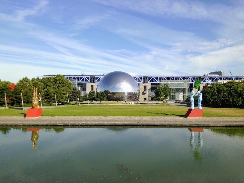 La Villette - La Villette in Paris is where imagination and innovation meet, creating a playground for families and curious travelers alike. Once the site of the city’s sprawling 19th-century slaughterhouses, this vast 55-hectare park has been transformed into a spectacular hub of culture, learning, and recreation. Here, grassy lawns and whimsical themed gardens invite children to explore, while adults marvel at bold architectural follies and striking modern design. What makes La Villette truly special is its vibrant blend of arts, science, and nature. You can step inside Europe’s largest science museum, discover the legendary Cité de la Musique, or catch a show at the iconic Philharmonie de Paris and Le Zénith concert hall. The park is also home to creative playgrounds, interactive exhibits, and even a retired submarine waiting to be explored. Throughout the year, open-air festivals, exhibitions, and performances bring the park to life, making every visit a new adventure. With its rich history—preserved in the majestic Grande Halle and the relocated Fontaine aux Lions de Nubie—La Villette is more than just a park; it’s a living, breathing celebration of Parisian creativity and community.