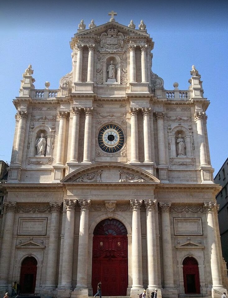 Paroisse Saint-Paul Saint-Louis - Step into the heart of Paris’s vibrant Marais district and discover **Paroisse Saint-Paul Saint-Louis**, a church where centuries of history and artistry come alive for visitors of all ages. Built in the 17th century at the request of King Louis XIII, this remarkable church was the first in Paris to fully embrace the dramatic Baroque style, breaking away from traditional Gothic architecture and setting a bold new standard for the city’s churches. Its grand façade and luminous, spacious interior—designed by Jesuit architects—invite families and travelers to explore a space once filled with royal ceremonies and historic events. Inside, you’ll find treasures that fascinate both art lovers and curious minds: masterpieces like Delacroix’s “Christ in Agony in the Garden of Olives,” stunning sculptures, and even a crucifix rescued from the Bastille prison. The church is home to magnificent organs, including one classified as a Historical Monument, and unique relics such as clam-shell fonts donated by Victor Hugo for his daughter’s wedding. Whether you’re admiring the soaring dome—one of Paris’s first—or soaking in the peaceful atmosphere, Saint-Paul Saint-Louis offers a captivating journey through Parisian history, architecture, and culture that will delight families and curious travelers alike.
