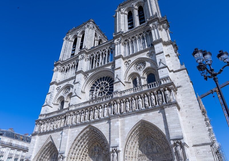 Notre-Dame Cathedral of Paris - Notre-Dame Cathedral of Paris stands as a breathtaking masterpiece at the heart of the city, captivating families and travelers alike with its soaring Gothic architecture and storied past. Rising above the Île de la Cité, Notre-Dame has watched over Paris since its construction began in 1163—a project that spanned nearly two centuries and incorporated the boldest trends of Gothic design, from its dramatic flying buttresses to its intricate rose windows. This iconic cathedral has been the backdrop for many of France’s most significant moments, from royal weddings to the coronation of Napoleon Bonaparte. Its legacy has been shaped by centuries of change, including a remarkable restoration following the devastating fire of 2019—a testament to the world’s devotion to this beloved monument. Inside, visitors are awestruck by the vast vaulted ceilings, luminous stained glass, and the sense of wonder that fills every corner. Children and adults alike can marvel at the legendary gargoyles and explore the crypt, which reveals layers of Parisian history beneath their feet. Notre-Dame isn’t just a church; it’s a living symbol of resilience, artistry, and the enduring spirit of Paris.