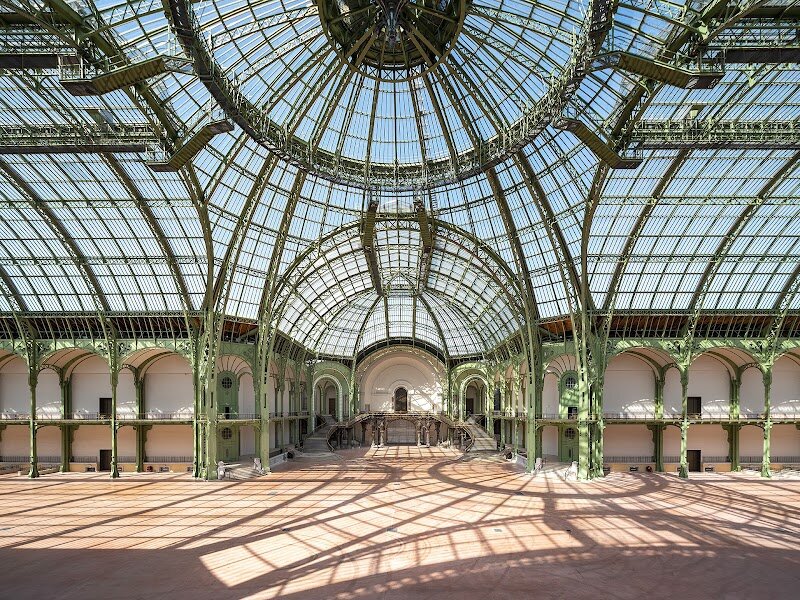 Grand Palais - Step beneath the soaring glass roof of the **Grand Palais** and discover a Parisian icon where history, art, and imagination come alive for visitors of all ages. Built for the dazzling 1900 Universal Exposition, this architectural marvel blends the grandeur of Classical stone facades with the swirling ironwork of Art Nouveau, crowned by an immense glass vault—the largest in Europe—that bathes its vast nave in natural light. Families and curious travelers will be captivated by the Grand Palais's unique character: not only is it a masterpiece of design, but it’s also a vibrant hub for culture and creativity. Explore spectacular art exhibitions in the Galeries Nationales, spark young minds at the interactive science museum in the Palais de la Découverte, or marvel at the ever-changing array of events beneath the glass dome—from fashion shows to sporting competitions. Every visit is a journey through time: imagine the excitement of world’s fairs, the glamour of historic gatherings, and the ongoing renewal of this beloved monument. Whether you’re an art lover, a science enthusiast, or simply seeking inspiration, the Grand Palais promises unforgettable experiences for the whole family in the very heart of Paris.