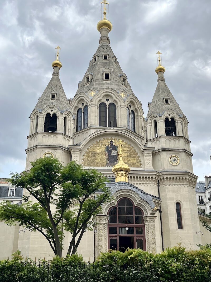Cathedrale Saint Alexandre Nevsky - Cathedrale Saint Alexandre Nevsky is a dazzling jewel tucked away in Paris’s 8th arrondissement, offering families and curious travelers a window into the city’s rich multicultural tapestry. Consecrated in 1861, it was the very first Russian Orthodox church built in France, made possible by the generosity of Tsar Alexander II and the growing Russian community that settled in Paris during the 19th century. Its striking Byzantine-Muscovite architecture—marked by golden onion domes and a Greek cross layout—stands out against the elegant Parisian streets, inviting admiration and wonder. Inside, visitors are greeted by a lavish display of gilded icons, frescoes, and a breathtaking central dome, all bathed in a serene, contemplative light. The cathedral’s richly decorated interior, including paintings by Alexei Bogolioubov, transports you straight into Russian spiritual tradition—an experience both adults and children will find memorable. History comes alive here, from the echoes of Russian émigrés who found solace in its walls after the 1917 Revolution, to the role the cathedral still plays as a vibrant center of worship and culture. Whether you’re seeking architectural beauty, a moment of peace, or a glimpse into Paris’s cosmopolitan heart, Cathedrale Saint Alexandre Nevsky promises a visit both inspiring and unforgettable.