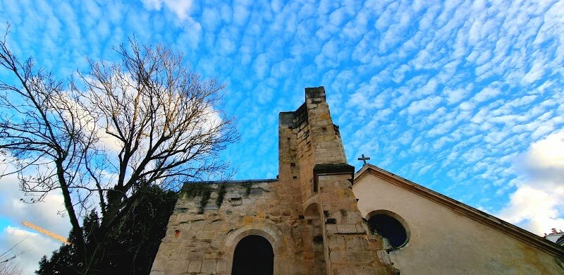 Saint-Julien-le-Pauvre - Saint-Julien-le-Pauvre, nestled in the heart of Paris’s Latin Quarter, is a captivating gem for families and curious travelers alike. Often described as *the oldest church in Paris*, this intimate sanctuary dates back to the 12th century, standing quietly just steps from Notre-Dame. Its walls echo centuries of history—from its origins on the ruins of a 6th-century oratory that once welcomed weary pilgrims, to its vibrant role in the intellectual life of medieval Paris, serving scholars and students of the burgeoning University of Paris. What makes Saint-Julien-le-Pauvre truly special is its blend of architectural beauty and spiritual heritage. Inside, visitors discover a harmonious fusion of Romanesque and early Gothic styles, with intricate capitals and a distinctive Byzantine iconostasis adorned with golden icons—a testament to its current use by the Greek Melkite Catholic community. The church’s modest size and tranquil atmosphere offer a peaceful escape from the city’s bustle, inviting families to explore, reflect, and even share legends like that of Julian the Hospitaller. Step outside into Square Viviani, where children can marvel at Paris’s oldest tree and everyone can enjoy stunning views of Notre-Dame. Saint-Julien-le-Pauvre is not just a monument, but a living storybook in stone, perfect for those seeking wonder and history in equal measure.