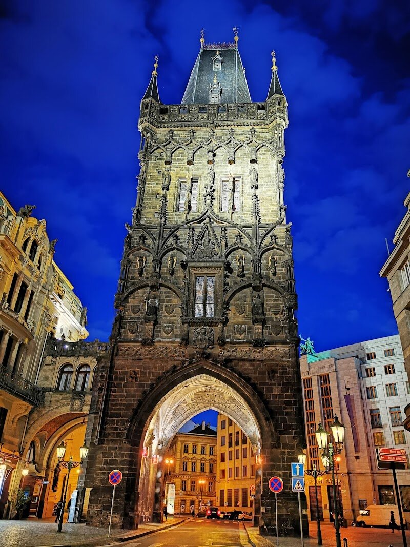 The Powder Tower - Rising proudly at the gateway to Prague’s Old Town, **The Powder Tower** is a medieval marvel that has watched over the city for more than 550 years. Originally built in 1475 as an ornate city entrance for royal coronation processions, this Gothic landmark still dazzles families and curious travelers with its storied past and striking architecture. Once called the “New Tower,” it marked the boundary between Old and New Town, and its design was inspired by the famous Old Town Bridge Tower. Throughout the centuries, the Powder Tower served many purposes—from collecting customs and tolls to its legendary (though debated) role as a gunpowder storage facility, which gave it its evocative name. Today, visitors can climb its winding staircase to enjoy panoramic city views, explore exhibits detailing Prague’s history, and marvel at intricate neo-Gothic sculptures added during its 19th-century restoration. Kids and adults alike are drawn to its dramatic façade and the stories etched in every stone—making it a perfect spot for family photos and historical adventures. Stepping inside, you’re not just entering a tower, but journeying through Prague’s royal, artistic, and architectural legacy.