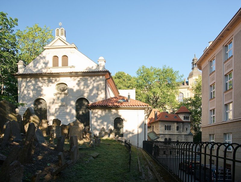 Old Jewish Cemetery - Step into the Old Jewish Cemetery in Prague and you’ll find yourself transported into a world where history breathes between ancient, timeworn stones. Tucked in the heart of the Jewish Quarter, this remarkable site dates back to 1439 and is among the oldest surviving Jewish burial grounds in the world. What makes it truly extraordinary is how, for over three centuries, Prague’s Jewish community laid their loved ones to rest here—even as space ran out, resulting in graves layered up to ten deep and over 12,000 gravestones crowding together in evocative disarray. Families and curious travelers alike will be captivated by the stories etched into the intricately decorated headstones, each adorned with symbolic motifs of animals and plants. As you wander the winding paths, you’ll encounter the resting places of legendary figures such as Rabbi Judah Loew—the famed Maharal of Prague, associated with the mystical Golem—and community leaders like Mordecai Maisel. The cemetery is not only a moving monument to resilience and remembrance but also a living classroom, offering a powerful glimpse into centuries of Jewish culture, art, and tradition in Prague. Every visit promises moments of reflection and discovery, making it a must-see for anyone eager to connect with the city’s rich past.