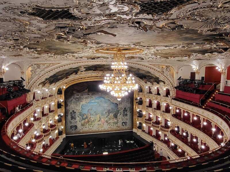 State Opera - The State Opera in Prague is a dazzling treasure for families and travelers eager to experience the city’s rich cultural tapestry. Opened in 1888, this majestic theater is a superb example of **neo-classical architecture**, with a grand façade adorned by sculptor Theodor Friedl’s ornate tympanum depicting the myth of Orpheus. Step inside and you’ll be greeted by a **spacious auditorium** and a lavish neo-Rococo interior—often cited as one of the most beautiful in Europe. What truly sets the State Opera apart is its vibrant history. Once the heart of Prague’s German-speaking community, it has welcomed world-renowned artists and hosted landmark premieres since its inaugural performance of Wagner’s *Die Meistersinger von Nürnberg*. Over the decades, the opera has evolved, blending Czech and European traditions, and today it stands as a symbol of Prague’s multicultural spirit. Visitors can immerse themselves in **world-class opera and ballet performances**, enjoy modern comforts like multilingual surtitles, and marvel at the stunning décor that evokes the golden age of theater. Whether you’re introducing children to the magic of live music or seeking inspiration from history and artistry, the State Opera promises an unforgettable journey for all ages.