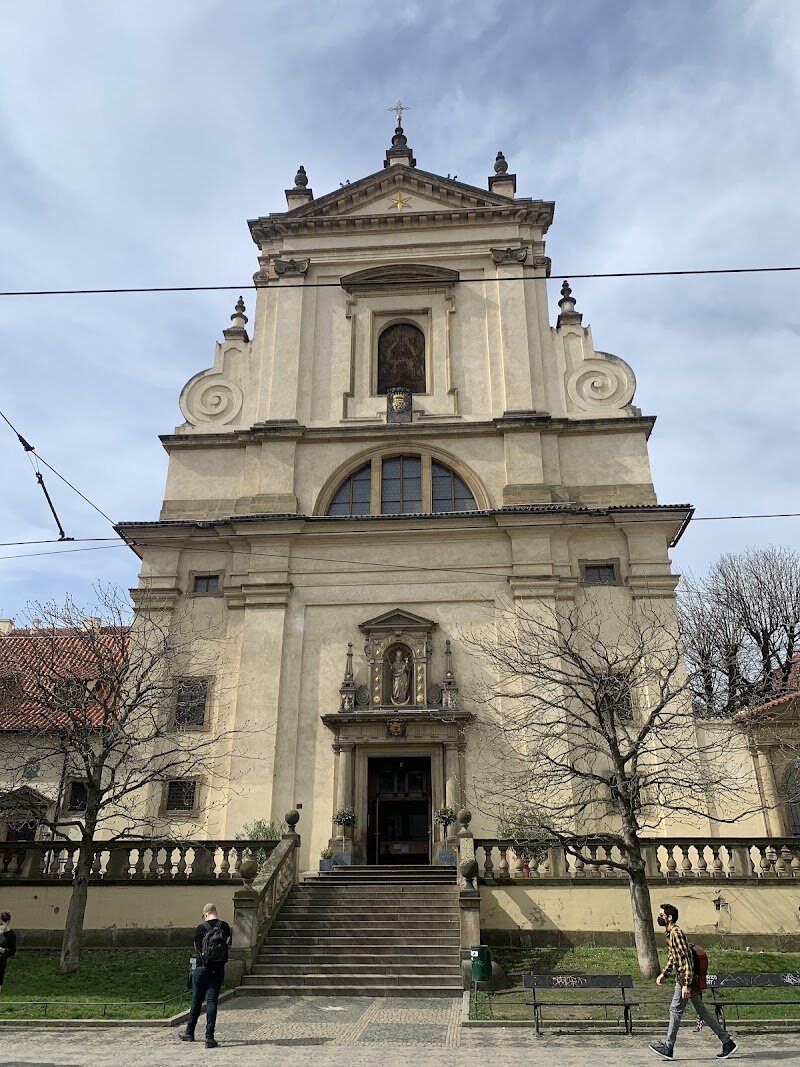 Church of Our Lady Victorious and The Infant Jesus of Prague - Step into the Church of Our Lady Victorious and the Shrine of the Infant Jesus of Prague, a place where centuries of history and heartfelt devotion come alive for visitors of all ages. Nestled in Prague’s charming Lesser Town, this striking church blends Renaissance and Baroque architecture, inviting families and travelers to discover its storied past and spiritual treasures. What truly sets this church apart is the world-famous statue of the **Infant Jesus of Prague**, a 16th-century figure said to bring blessings and miracles to those who pray before it. The statue’s journey—from its Spanish origins to a gift from Princess Polyxena of Lobkowicz in 1628—reflects the resilience and faith of Prague through wars, upheaval, and cultural change. Today, the church stands as a symbol of hope and peace, drawing pilgrims and curious visitors from around the world. Inside, you’ll find beautiful altars, vibrant paintings, and a free museum displaying the ornate robes and crowns of the Infant Jesus—perfect for sparking wonder in children and adults alike. Whether you come seeking inspiration, history, or simply a unique experience, the Church of Our Lady Victorious offers a welcoming space to explore Prague’s spiritual heart.