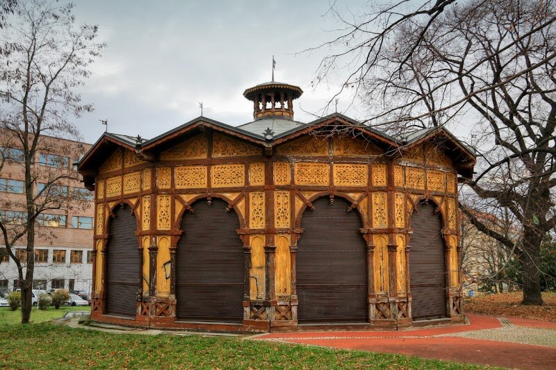 Letna Park Carousel - Letna Park Carousel in Prague is a magical blend of history and delight, enchanting visitors for over a century. Built in 1894 by master carpenter Matěj Bílek, it is recognized as the **oldest operating carousel in Europe**. Nestled within Letna Park, its Neo-Renaissance wooden pavilion—with a striking cupola—evokes a timeless atmosphere that appeals to families and curious travelers alike. What truly sets the carousel apart are its **remarkably realistic horses**, crafted from iron frames, carved wooden heads and legs, and covered in authentic horsehide. These figures have witnessed generations of riders, from local children to visiting adults, and even hold secrets of the past—restorations revealed hidden newspaper clippings and coins from the Austro-Hungarian era inside the horses. Visitors today can enjoy the gentle thrill of riding on these historic horses or charming miniature cars, all to the lively tunes of a vintage orchestrion, just as in days gone by. The carousel’s enduring appeal lies in its ability to transport guests back in time, offering a playful, nostalgic escape amidst the lush scenery and vibrant energy of Letna Park. Whether you’re seeking family fun or a touch of Prague’s rich heritage, the Letna Park Carousel promises a truly unforgettable experience.