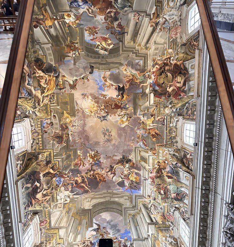 Chiesa di Sant'Ignazio di Loyola - Tucked away in the heart of Rome, the Church of Sant'Ignazio di Loyola is a breathtaking Baroque masterpiece that has captivated visitors for centuries. Built between 1626 and 1650 to honor the founder of the Jesuits, this stunning church is a testament to 17th-century architectural ingenuity. Its facade, designed by Orazio Grassi, sets the stage for the awe-inspiring interior, where the artistic genius of Andrea Pozzo comes alive. His trompe-l'œil fresco creates an illusion of a soaring dome, leaving onlookers spellbound. Families and curious travelers alike will be enchanted by the church's blend of art, history, and spirituality. Inside, you can explore exquisite side chapels, admire the high altar, and discover relics that hold deep significance for Jesuit spirituality. The church's modern twist—a large mirror allowing visitors to admire the fresco without straining their necks—has made it a viral sensation on social media. Whether you're a history buff or simply curious about Rome's hidden gems, Sant'Ignazio di Loyola is a must-visit destination that promises an unforgettable experience.