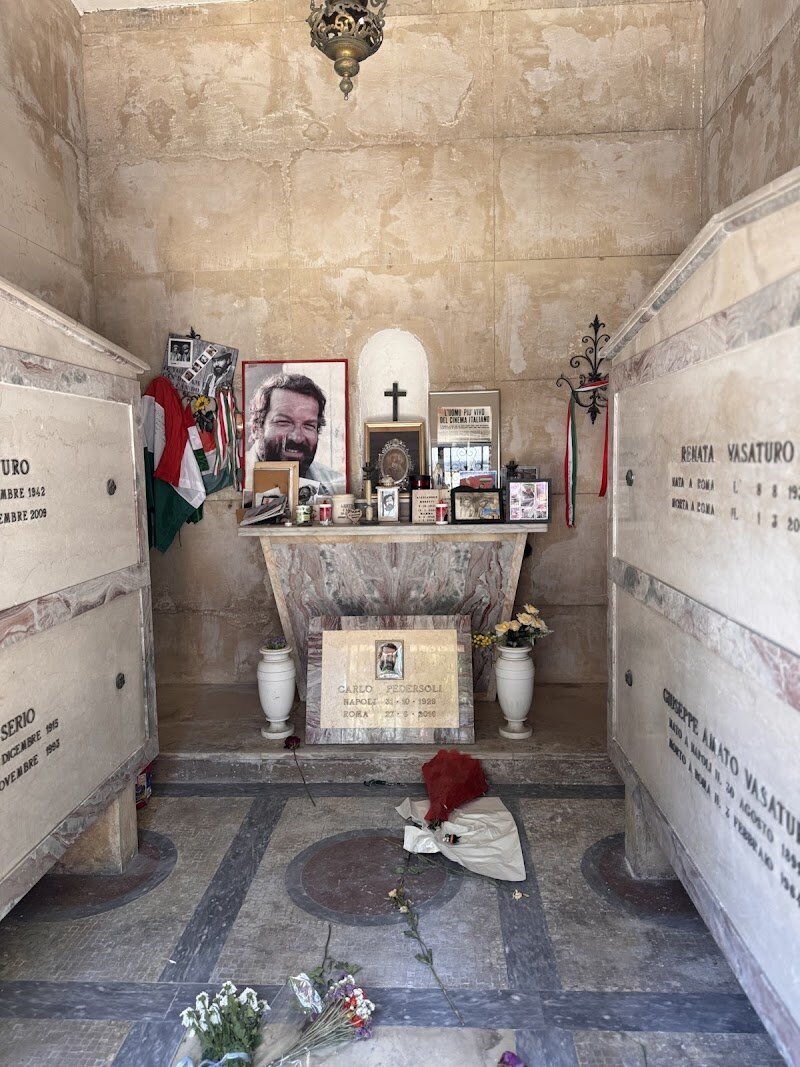 Tomba di Carlo Pedersoli-Bud Spencer - **Discover the Final Resting Place of a Beloved Icon: Tomba di Carlo Pedersoli-Bud Spencer** In the heart of Rome, nestled within the historic Campo Verano Cemetery, lies the tomb of Carlo Pedersoli, better known to the world as Bud Spencer. This gentle giant, famous for his roles in spaghetti westerns alongside Terence Hill, has left an indelible mark on cinema. The tomb is a poignant tribute to his enduring legacy, drawing visitors from around the globe. As you wander through the cemetery, you'll be surrounded by the rich history of Rome, with Bud Spencer's tomb serving as a fascinating stop. Families and curious travelers alike can pay their respects to this Italian icon, whose larger-than-life presence continues to captivate audiences. The tomb offers a glimpse into the life of a man who was not only a talented actor but also a champion swimmer and devoted philanthropist. Visitors can reflect on his remarkable journey, from his early days as a sportsman to his later years as a beloved actor, making this a truly unique and memorable experience.