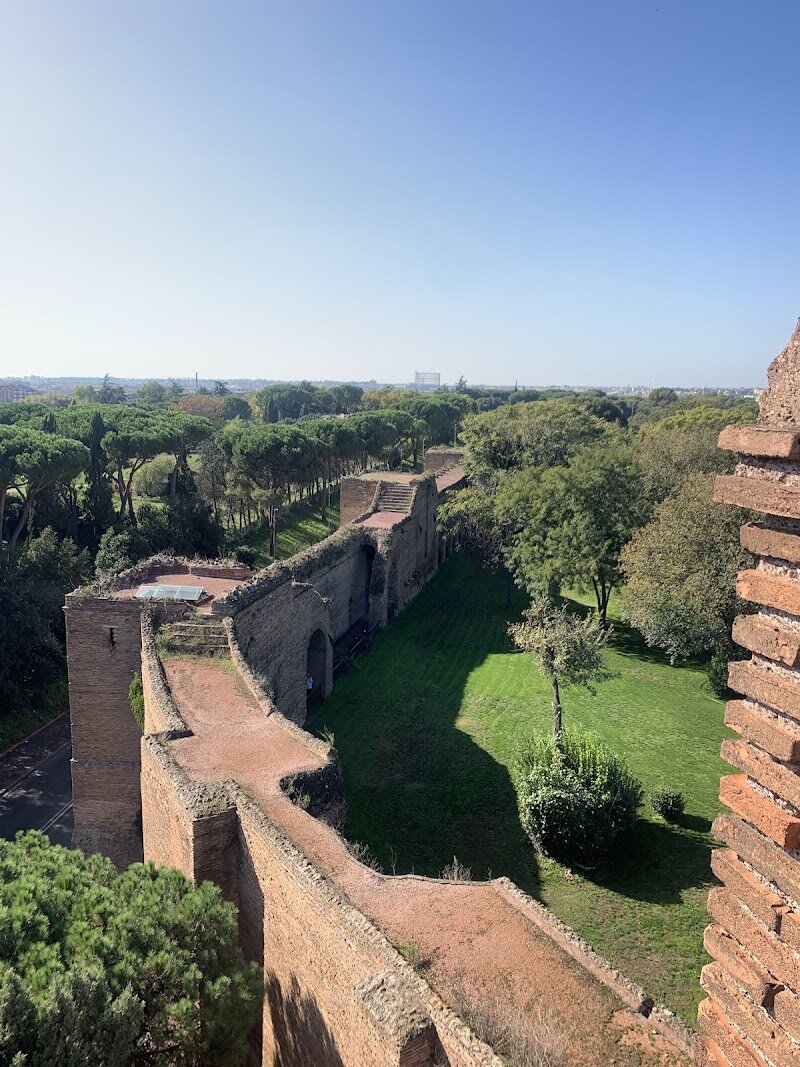 Aurelian Walls - Standing as Rome's largest ancient monument, the Aurelian Walls tell a dramatic story of an empire protecting its heart. Built between 271 and 275 CE, these magnificent fortifications stretch an impressive 12 miles around the city, encircling all seven hills of Rome and the charming Trastevere district. What makes these walls truly fascinating is how Emperor Aurelian built them with ingenious speed and efficiency, incorporating existing structures like the striking Pyramid of Cestius and ancient aqueducts directly into the design. Originally standing 26 feet high with a defensive tower every 100 feet, these brick-faced concrete barriers protected Rome from northern barbarian invasions for over a millennium. Today, you can walk alongside remarkably well-preserved sections and explore several of the original 18 gates that once controlled access to the Eternal City. The walls aren't just ancient stones—they're living history that successfully defended Rome through medieval times, the Renaissance, and even into the 19th century. For families and history enthusiasts alike, tracing these ancient fortifications offers an authentic connection to Rome's past while discovering how this engineering marvel shaped the city we see today.