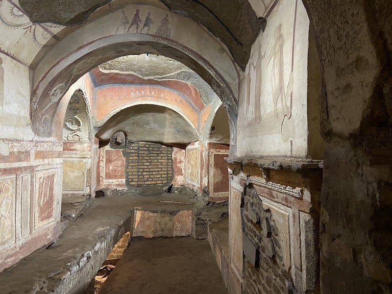 Catacombs of Priscilla - Step beneath Rome’s bustling streets and discover the **Catacombs of Priscilla**, a fascinating labyrinth that brings the city’s ancient Christian past vividly to life. Often called the “Queen of the Catacombs,” this remarkable site stretches over 13 kilometers and shelters the tombs of early Christian martyrs, popes, and thousands of faithful Romans from the 2nd to 5th centuries AD. Families and curious travelers alike will be captivated by the catacombs’ mysterious passages, where every corner reveals a story. What truly sets Priscilla apart are its **beautifully preserved frescoes**—some of the earliest known Christian art—including rare images of Biblical scenes, the Virgin Mary, and the Good Shepherd. Highlights include the evocative Greek Chapel and the Cubiculum of the Veiled Woman, offering glimpses into both faith and daily life nearly two millennia ago. As you wander these cool, silent corridors, you’ll follow in the footsteps of early Christians who once gathered here for both sorrow and hope. The Catacombs of Priscilla offer not just a historical adventure but a chance to experience the enduring spirit and artistry of ancient Rome—an unforgettable journey for all ages.