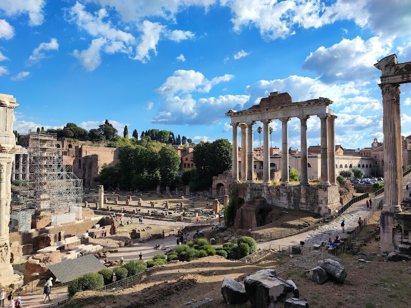 Basilica Julia - Tucked away in the heart of Rome's ancient landscape, the Basilica Julia is a testament to the city's rich history and architectural grandeur. Built by Julius Caesar in the 1st century BCE, this magnificent structure was initially constructed as a civil law court and meeting place. It was later completed by Augustus, who dedicated it in the names of his heirs, Gaius and Lucius Caesar. The basilica's impressive dimensions, measuring 101 by 49 meters, and its ornate design featuring marble columns and vaulted ceilings, made it a hub of activity in ancient Rome. Visitors can explore the remains of this once-majestic building, imagining the bustling atmosphere of ancient Rome. The site is dotted with intriguing artifacts, such as "tavole lusoriae," ancient board games carved into stone. Families and curious travelers alike will find themselves captivated by the blend of history and architectural beauty that the Basilica Julia offers. As you wander through the ruins, you'll uncover the layers of history that have shaped this iconic landmark, from its origins to its eventual decline and rebirth.